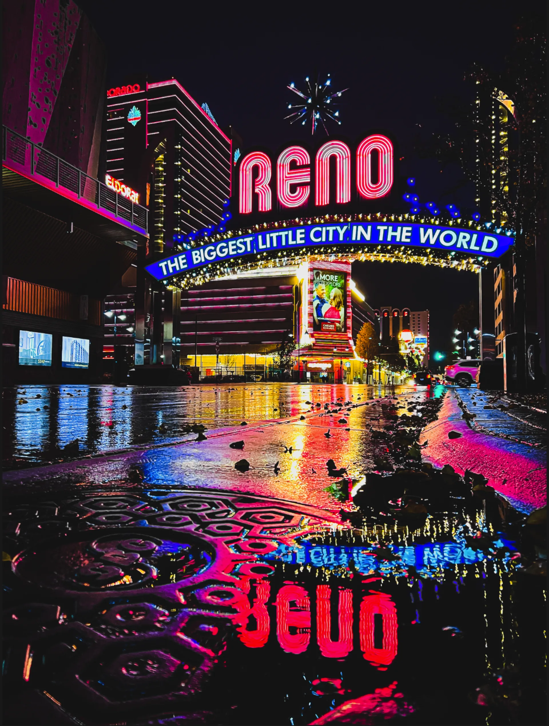The Reno arch at night — self-managing versus hiring an Airbnb property manager