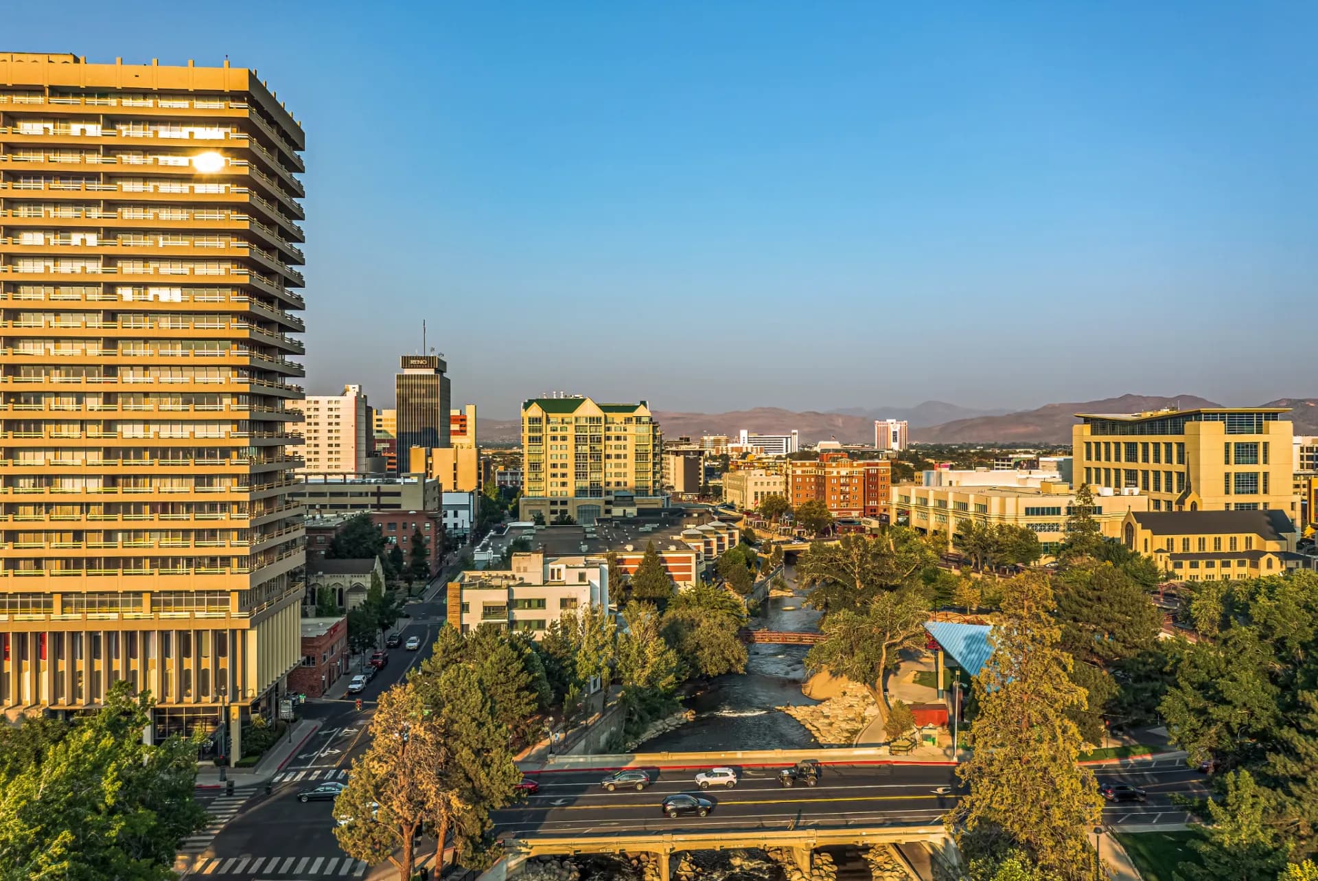 The Truckee River through Reno at golden hour — switching property management companies